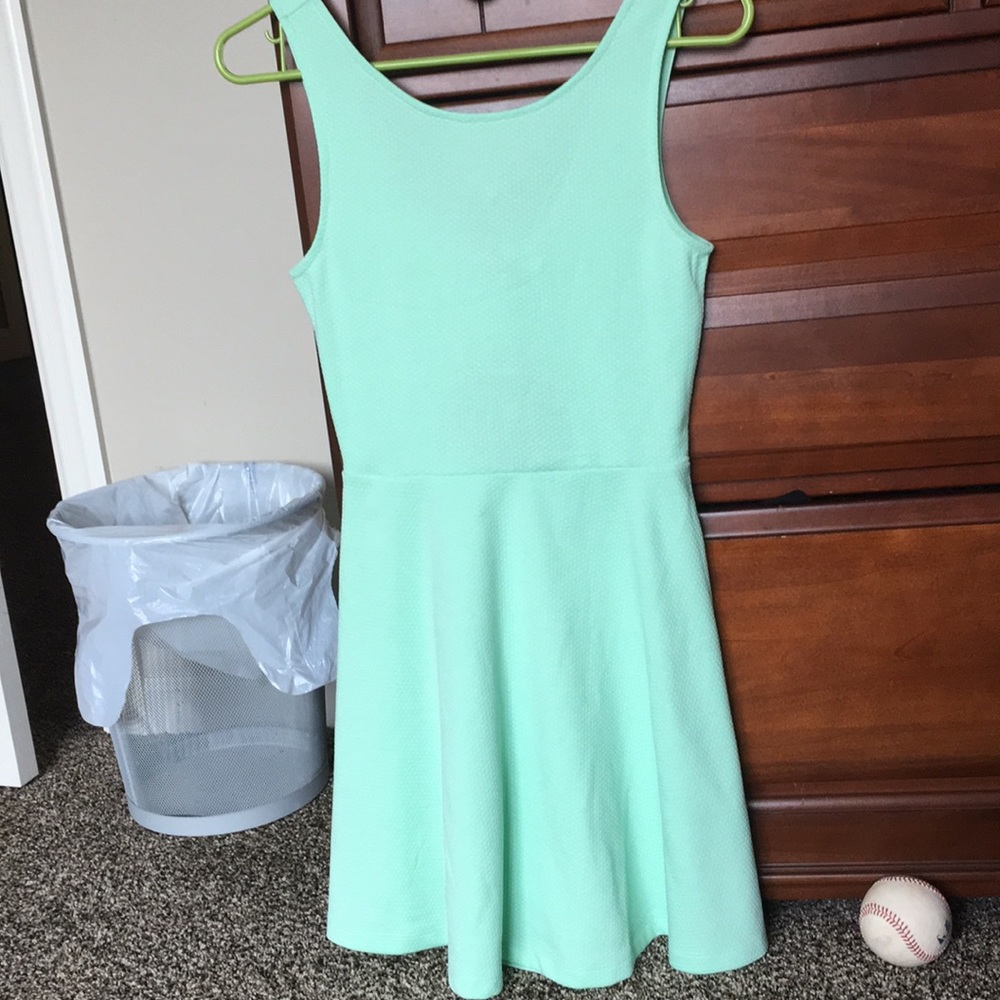 Mint green skater dress with back cut out